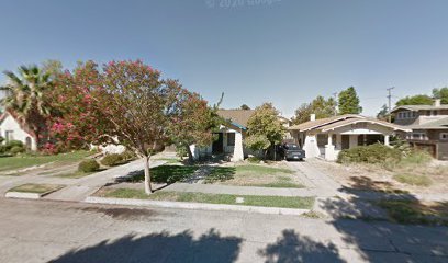 Fresno, CA home bought by Varo as-is: craftsman-style bungalows with a flowering tree out front